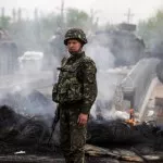 A Ukrainian soldier looks on at a Ukrainian checkpoint near the eastern town of Slaviansk May 2, 2014. Ukrainian forces attacked the rebel-held city of Slaviansk before dawn on Friday and pro-Russia separatists shot down at least one attack helicopter, killing a pilot, in a sharp escalation of the conflict. REUTERS/Baz Ratner (UKRAINE  - Tags: POLITICS CIVIL UNREST)