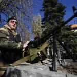 Pro-Russian separatist guards his position near the Kholodnaya Balka mine in Makiivka